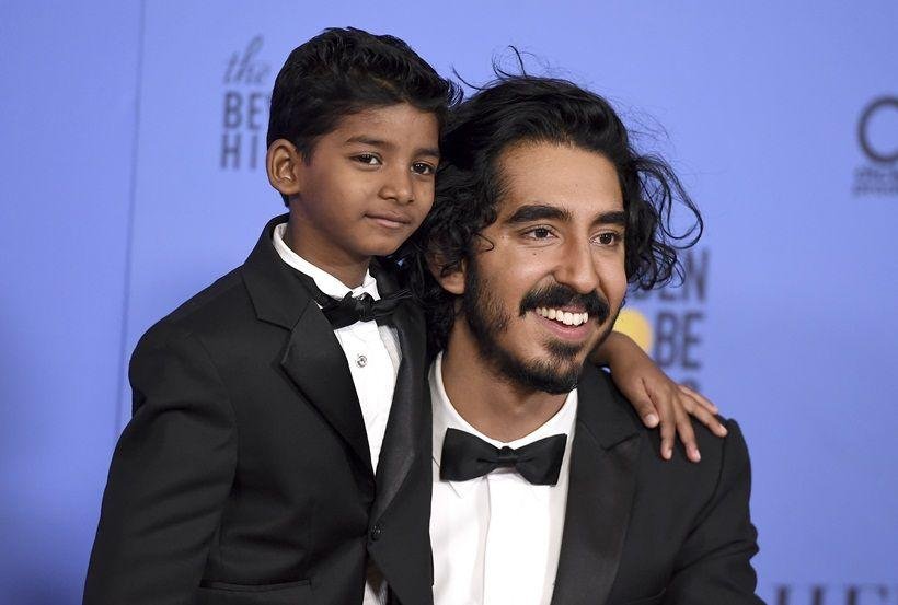 Sunny Pawar, left, and Dev Patel pose in the press room at the 74th annual Golden Globe Awards at the Beverly Hilton Hotel on Sunday, Jan. 8, 2017, in Beverly Hills, Calif. (Photo by Jordan Strauss/Invision/AP)