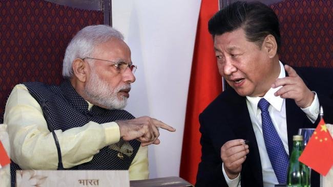 Indian Prime Minister Narendra Modi, left, talks with Chinese President Xi Jinping in 2016. Picture: AP Photo/Manish Swarup, File.Source:AP